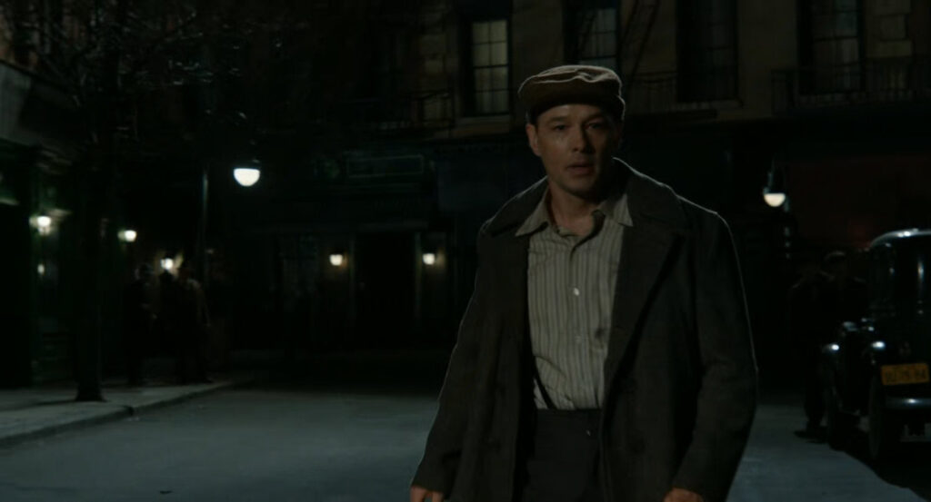 Addison on a dark street.