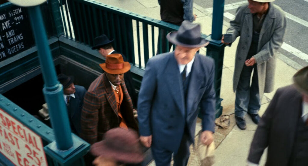 Robbie exits a subway station.