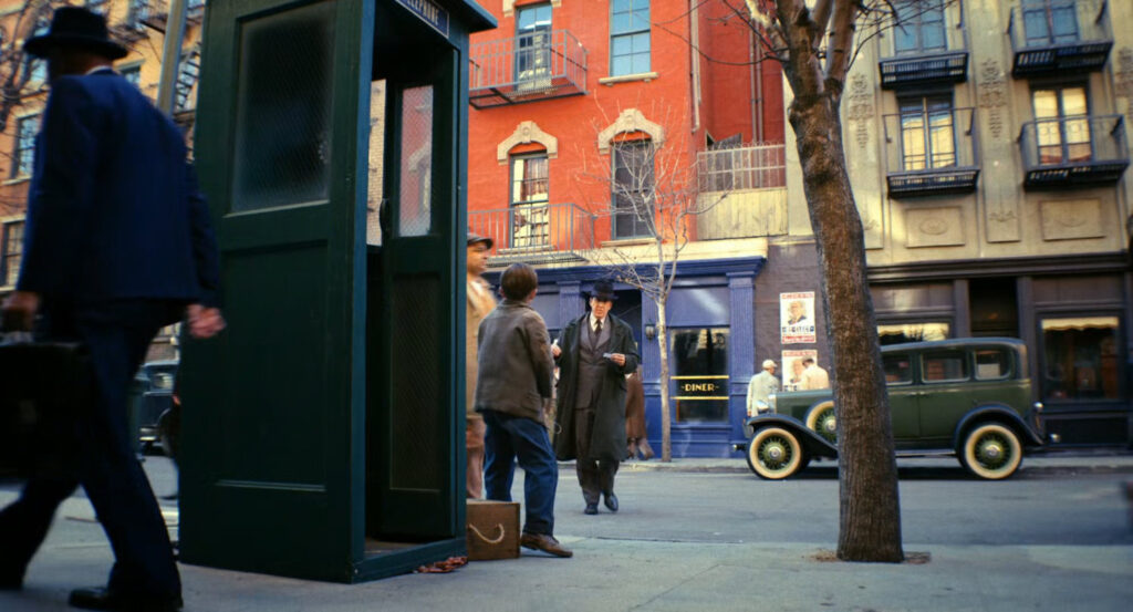 Ben crossing the street outside Millie's Diner to see Frankie.