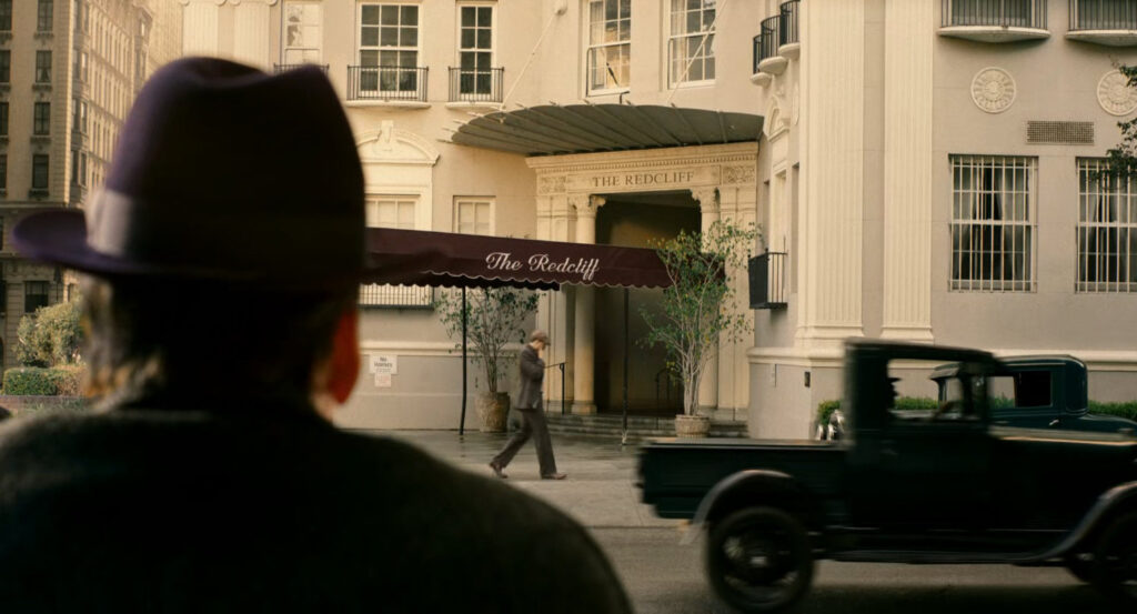 Ben watching the entrance of The Recliff apartments.