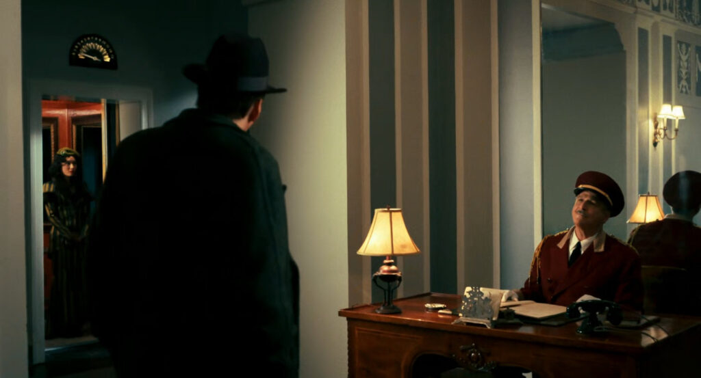 Ben speaking to the doorman in the lobby of The Redcliffe.
