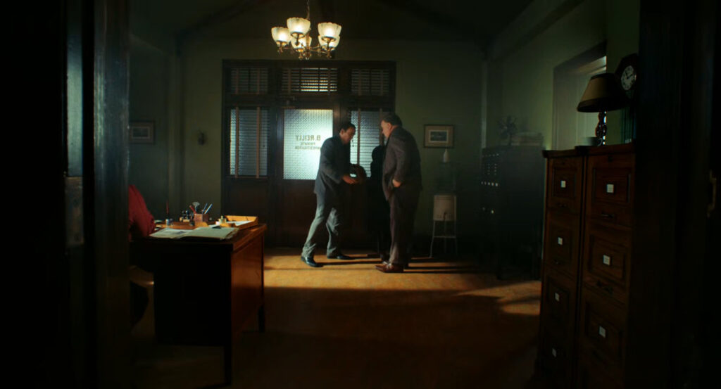 Ben and Carmedy in Ben's office.