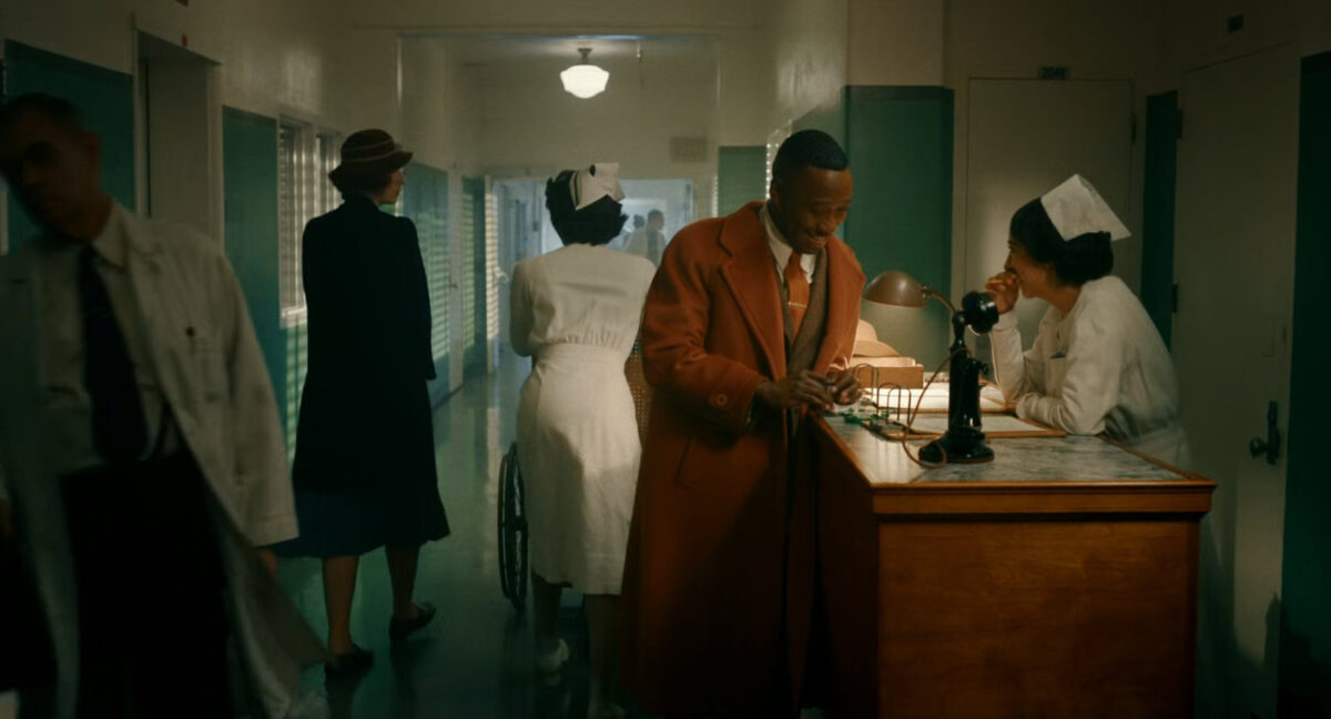 Robbie chats with a nurse at a hospital.