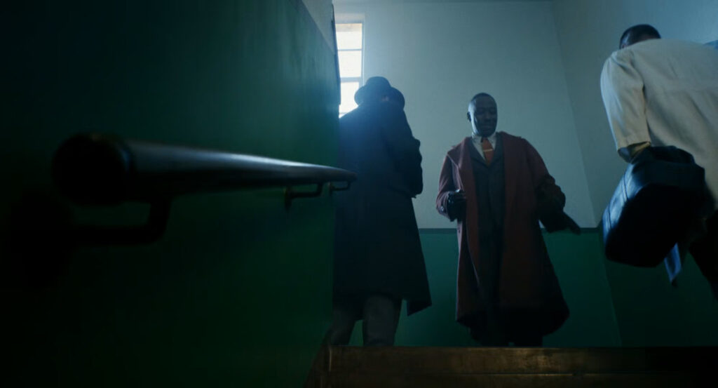 Robbie and Ben walking down stairs in a hospital.