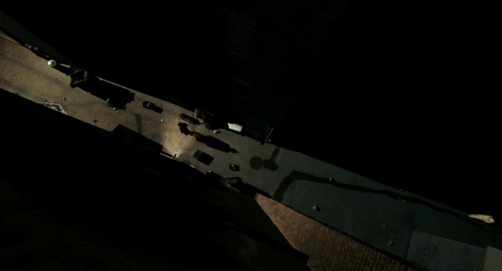 A dark alley by a construction site.