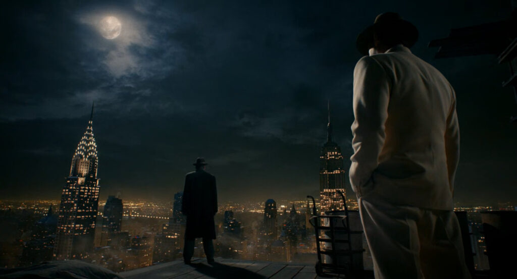 Ben and Flint standing on an under construction floor of a building at night.