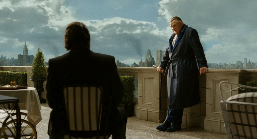 Winston and Silvermane on the balcony of the penthouse of the Hillhurst Hotel.