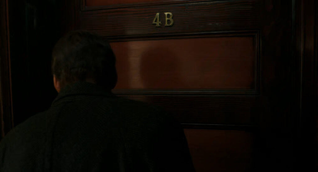 Ben at the door to his apartment.