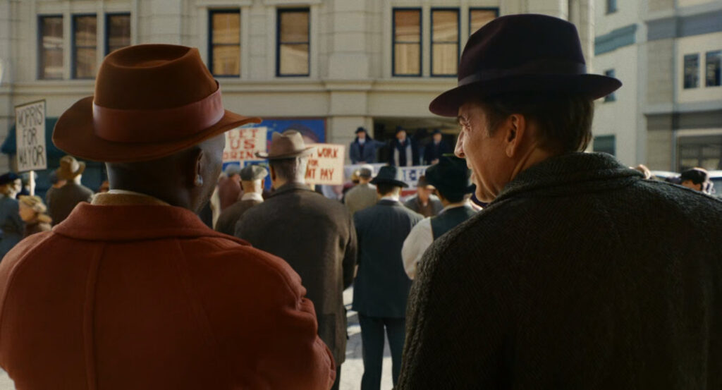 Robbie and Ben watching Mayor Alfred Alfred Morris giving a stump speech on a street corner.