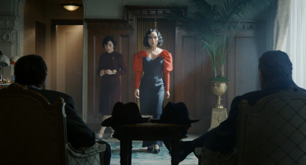 Cat showing off a new dress to Silvermane and Winston at a dress shop.