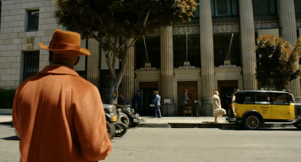 Robbie crossing the street towards the Geoffrey Hotel.