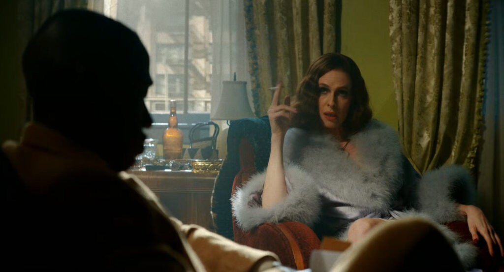 Robbie talking with Vera Addison in the Geoffrey Hotel.