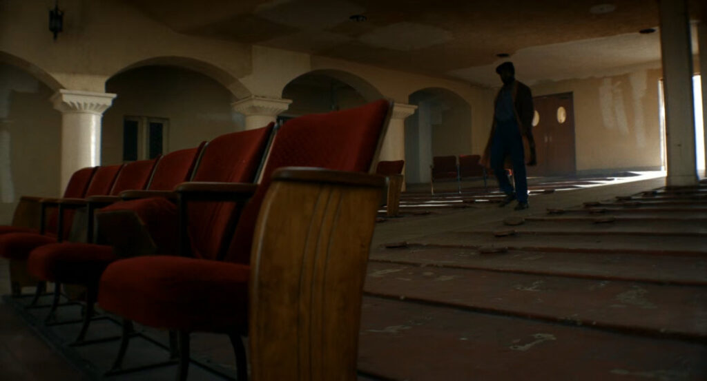 Lonnie inside an old theater.