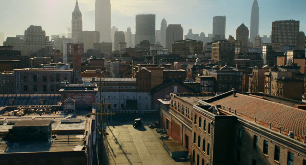 Aerial view of Silvermane's car driving onto a street at the docks.