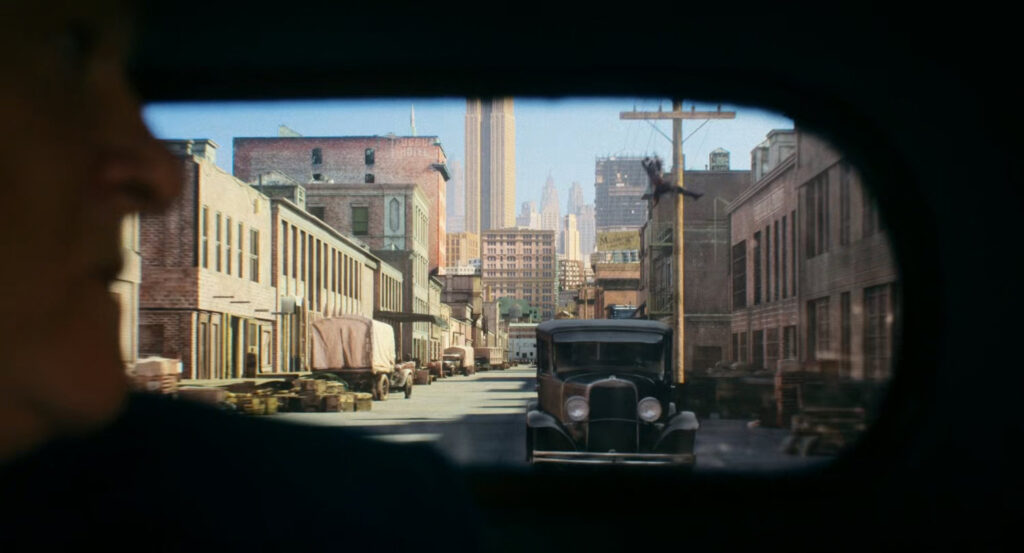 The Spider swinging towards Silvermane's car by the docks.