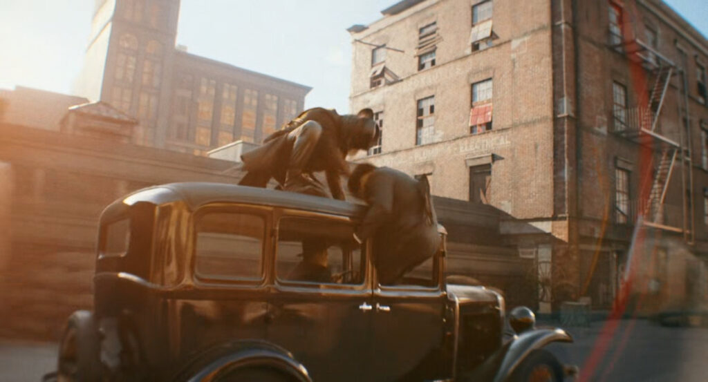 The Spider on top of Silvermane's car by the docks.