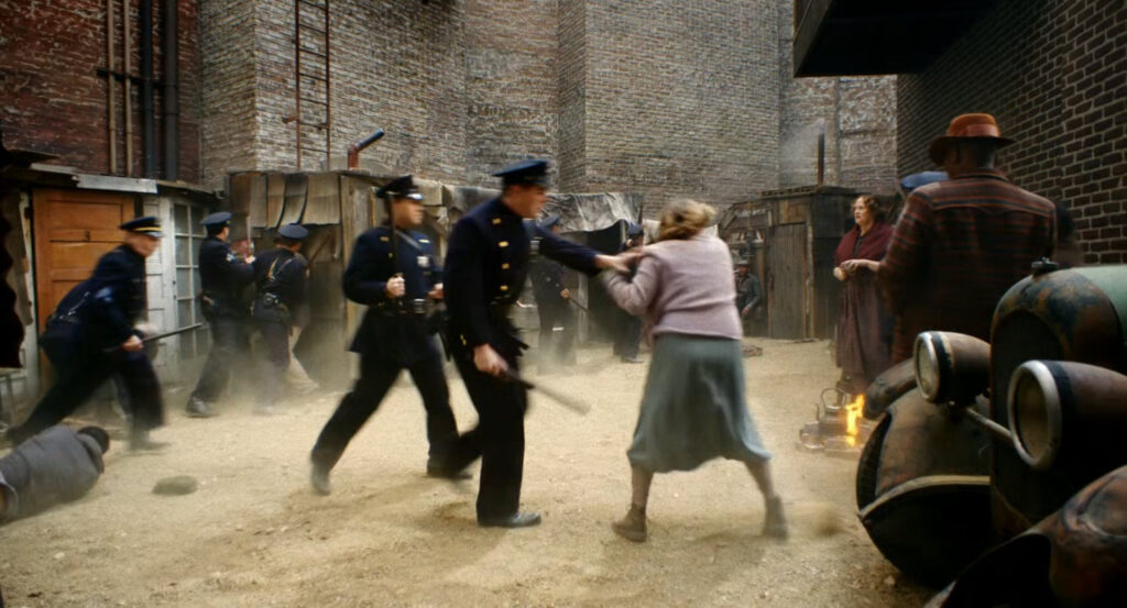 Cops roust people in Hooverville.