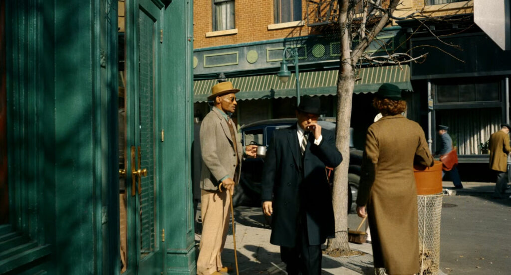 One of Silvermane's men following Ben on a sidewalk.