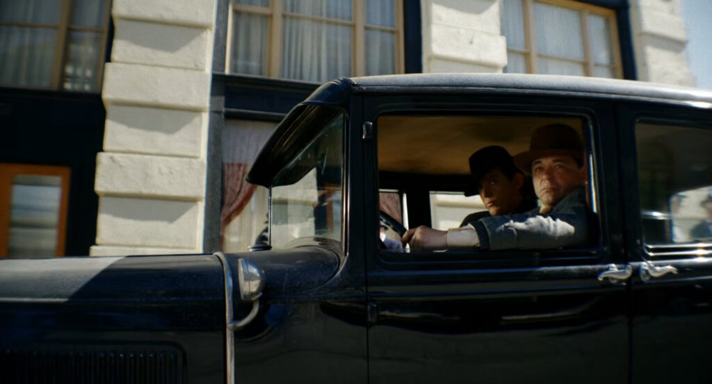 Two of Silvermane's men watching the entrance to the Geoffrey Hotel.