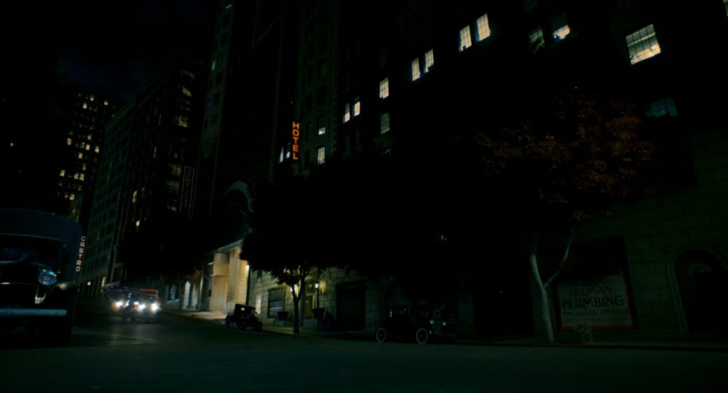 Silvermane's car driving past the Hillhurst Hotel.