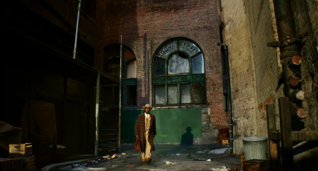 Robbie walking through a Harlem alley.