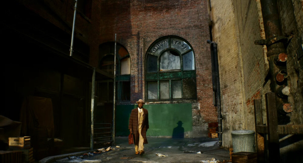Robbie walking through a Harlem alley.