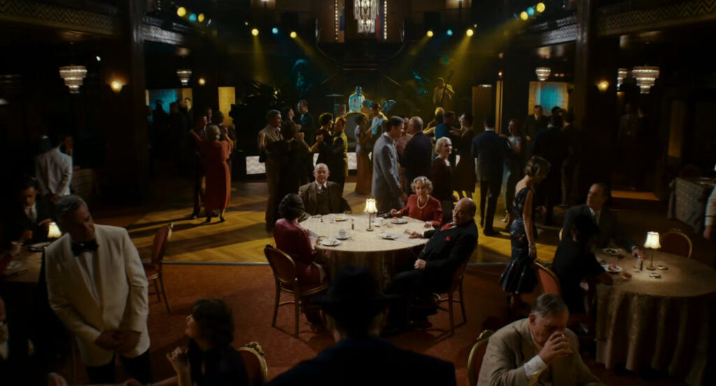The Mayor, Chief of Police, and their wives at a table in a restaurant club.