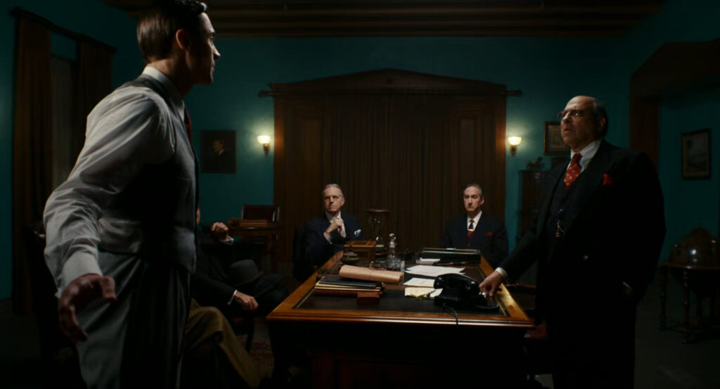 The Mayor talks to his men in his office.