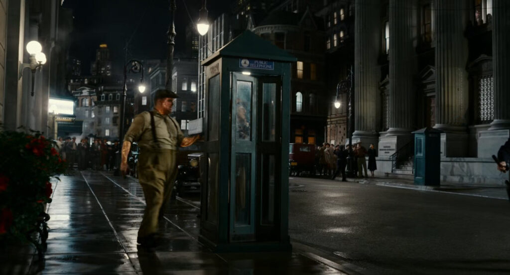 Leyden at a phone booth in the Diamond District.