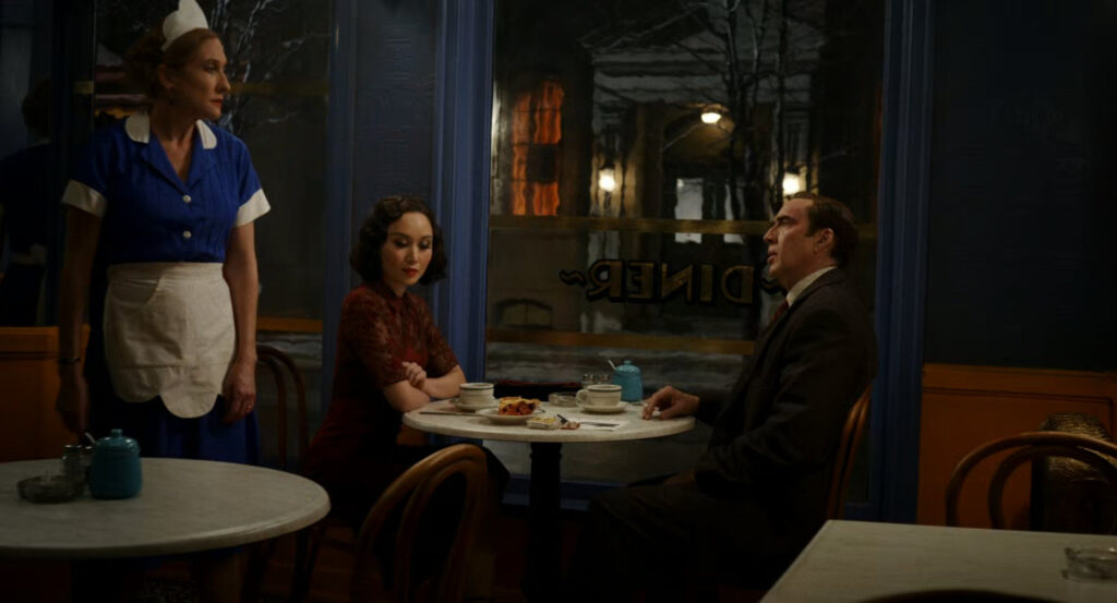 Ben and Cat chat with the waitress in Millie's Diner.