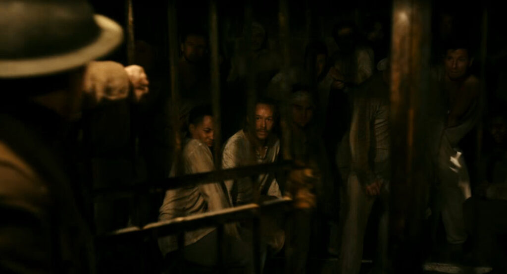 Flashback of Ben saving men from a prison during the war in France.