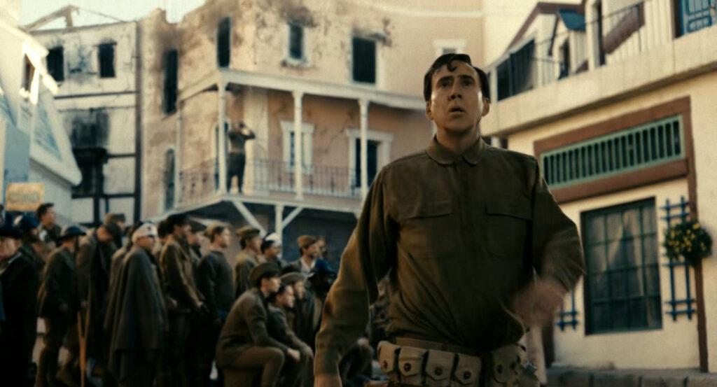 Flashback of Ben in front of rescued soldiers posing for a photo during the war in France.