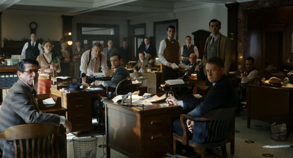 The newsroom staring at Robbie in the offices of the Daily Bugle.