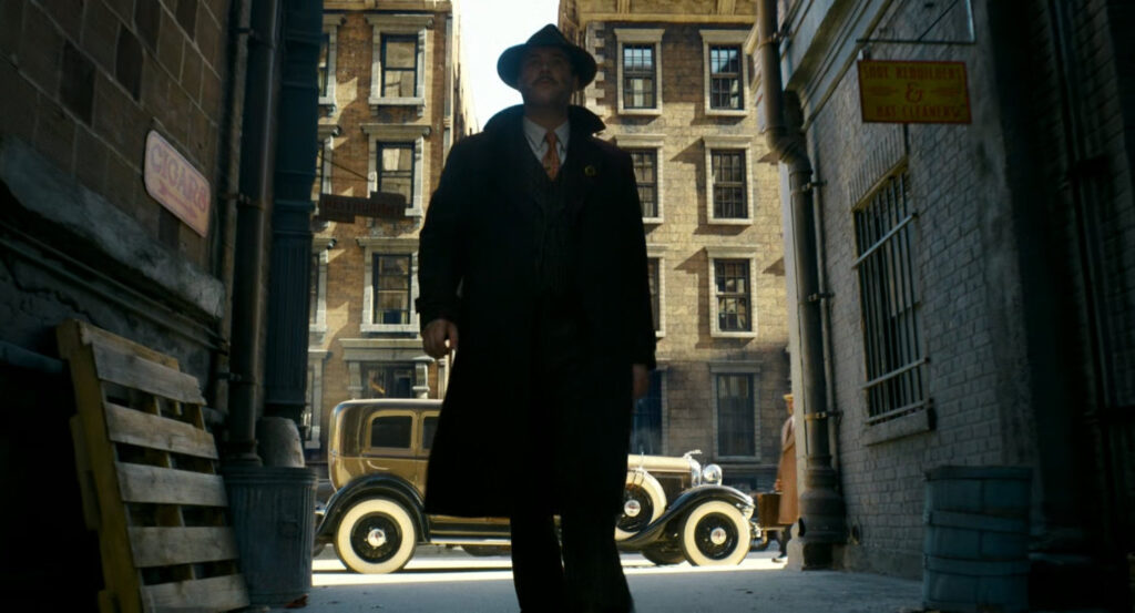 Flint entering an alley in Harlem.