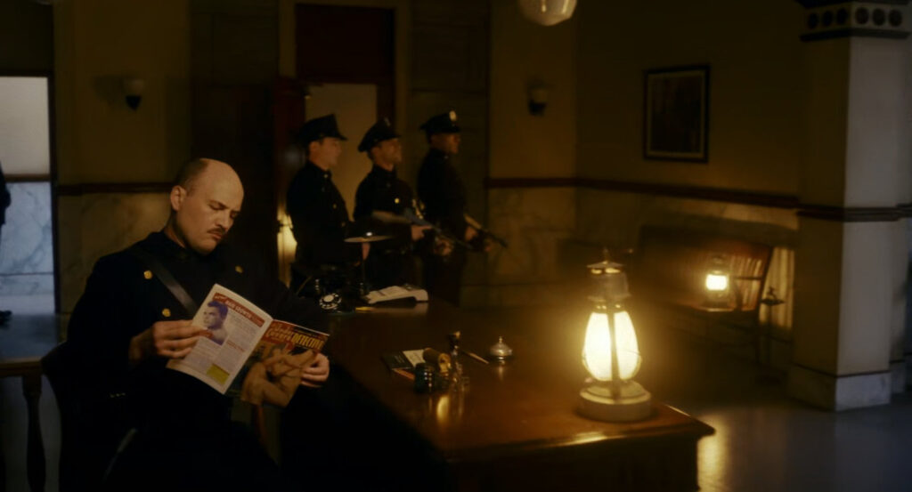 Police officers stand guard in police station.