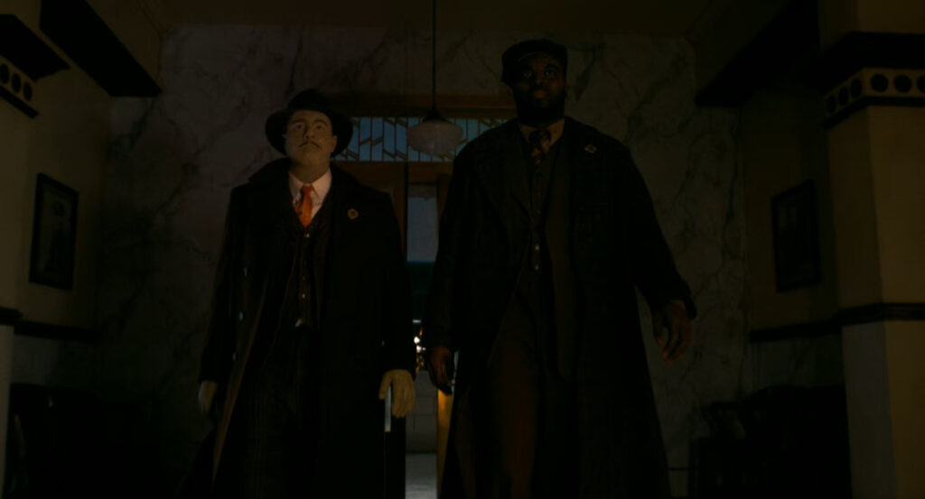 Flint and Lonnie entering police station.