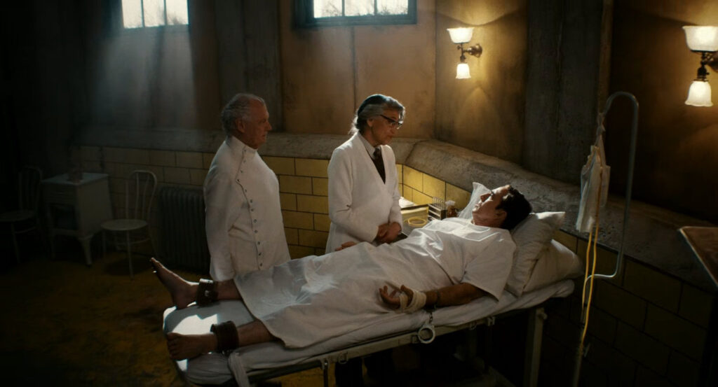 Ogden and Dr. Faber stand over a restrained Ben in Faber's Secret Lab.