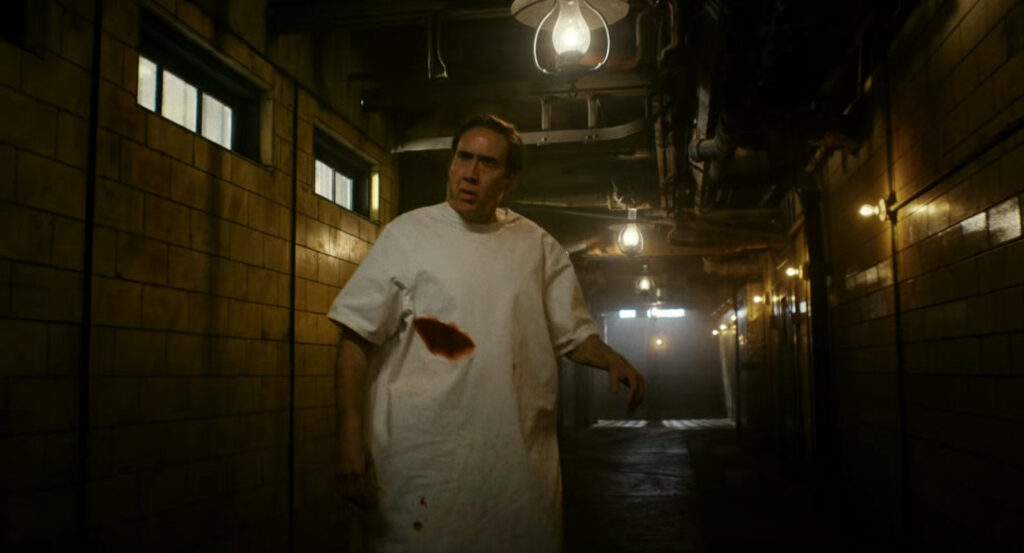 An injured Ben stumbling in the hallway of Faber's Secret Lab.