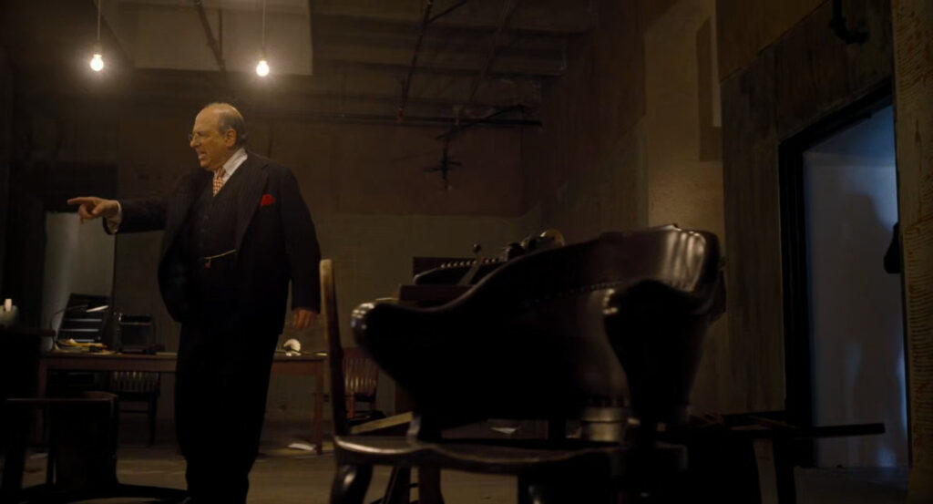 Mayor Morris observes a trashed campaign headquarters.