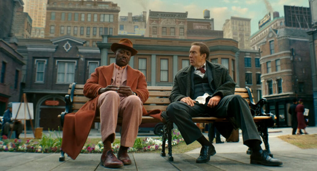Ben and Robbie sitting in a river side park.
