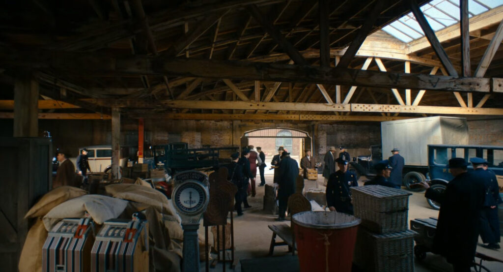 Silvermane's men and police officers in a warehouse in Harlem.