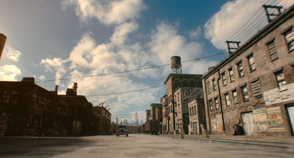 A car driving along a warehouse street in Harlem.