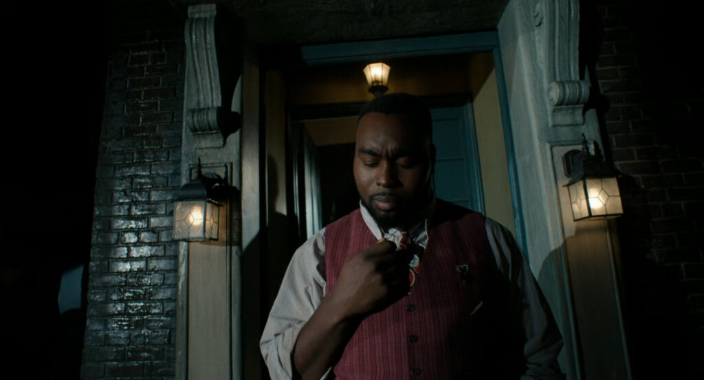 Lonnie outside Robbie's apartment building.