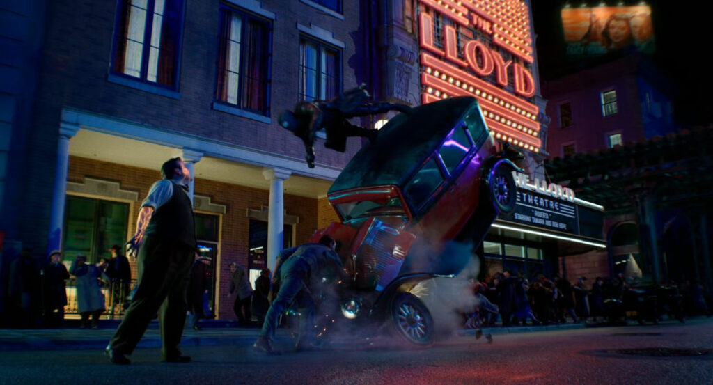 Leyden and Flint fight The Spider, by flipping a car outside a theater.