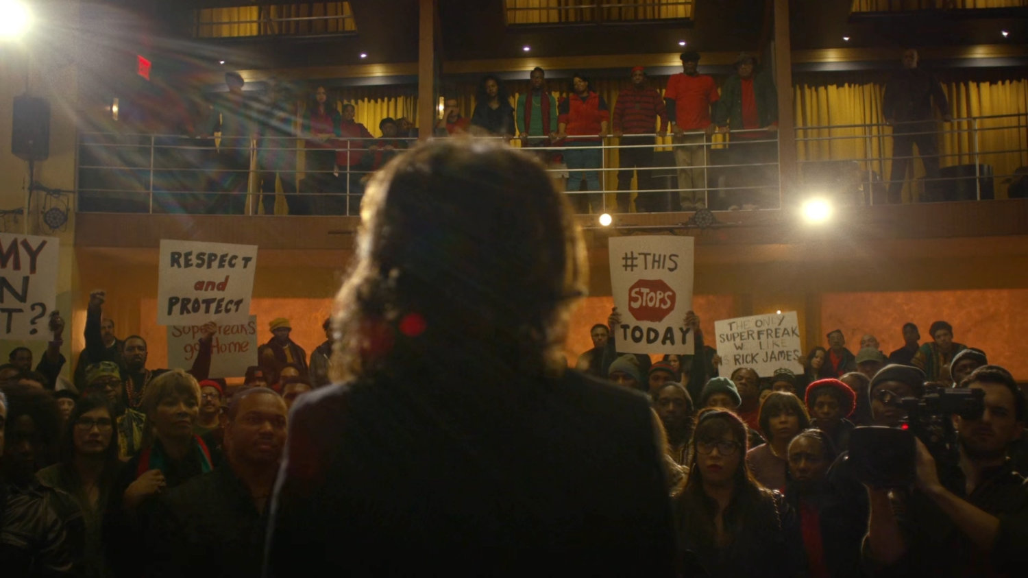 Mariah giving a speech to a crows in Harlem's Paradise.