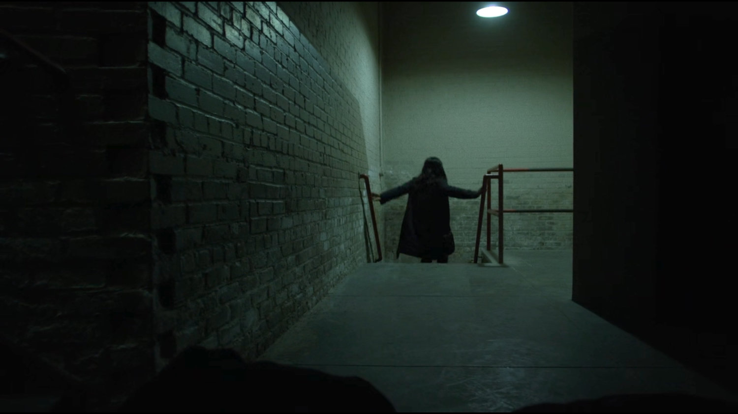 Claire in the basement stairway of Harlem's Paradise.