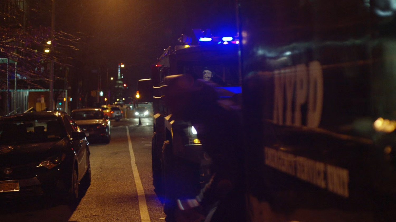Luke escaping from the NYPD paddy wagon.