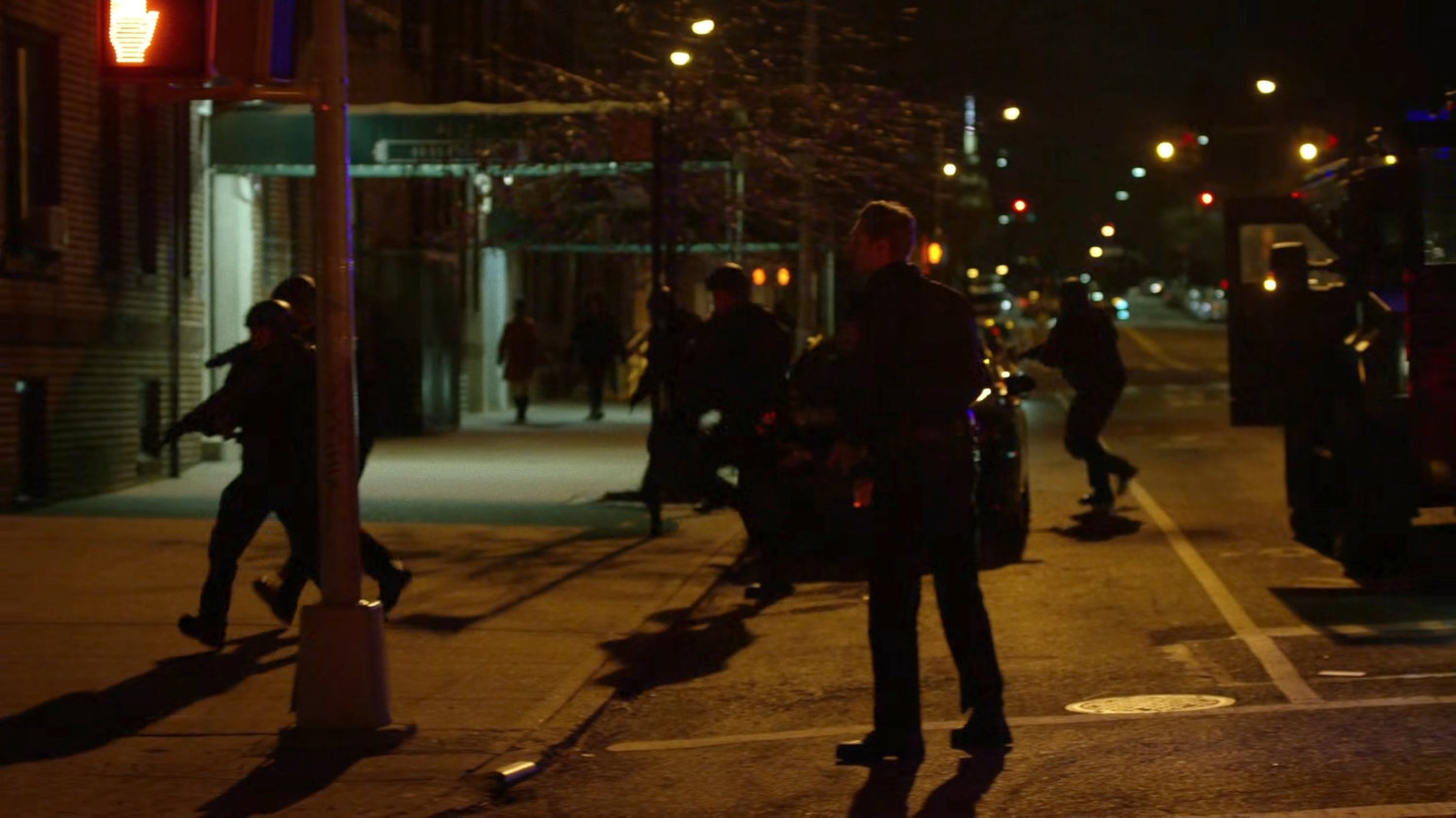 Officers converge on the escaped Luke Cage.