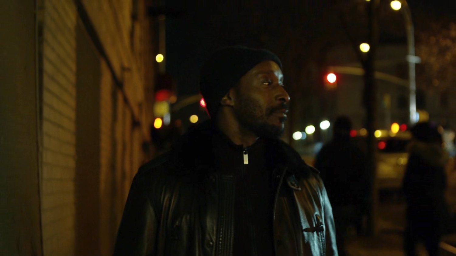 Turk on a dark sidewalk.