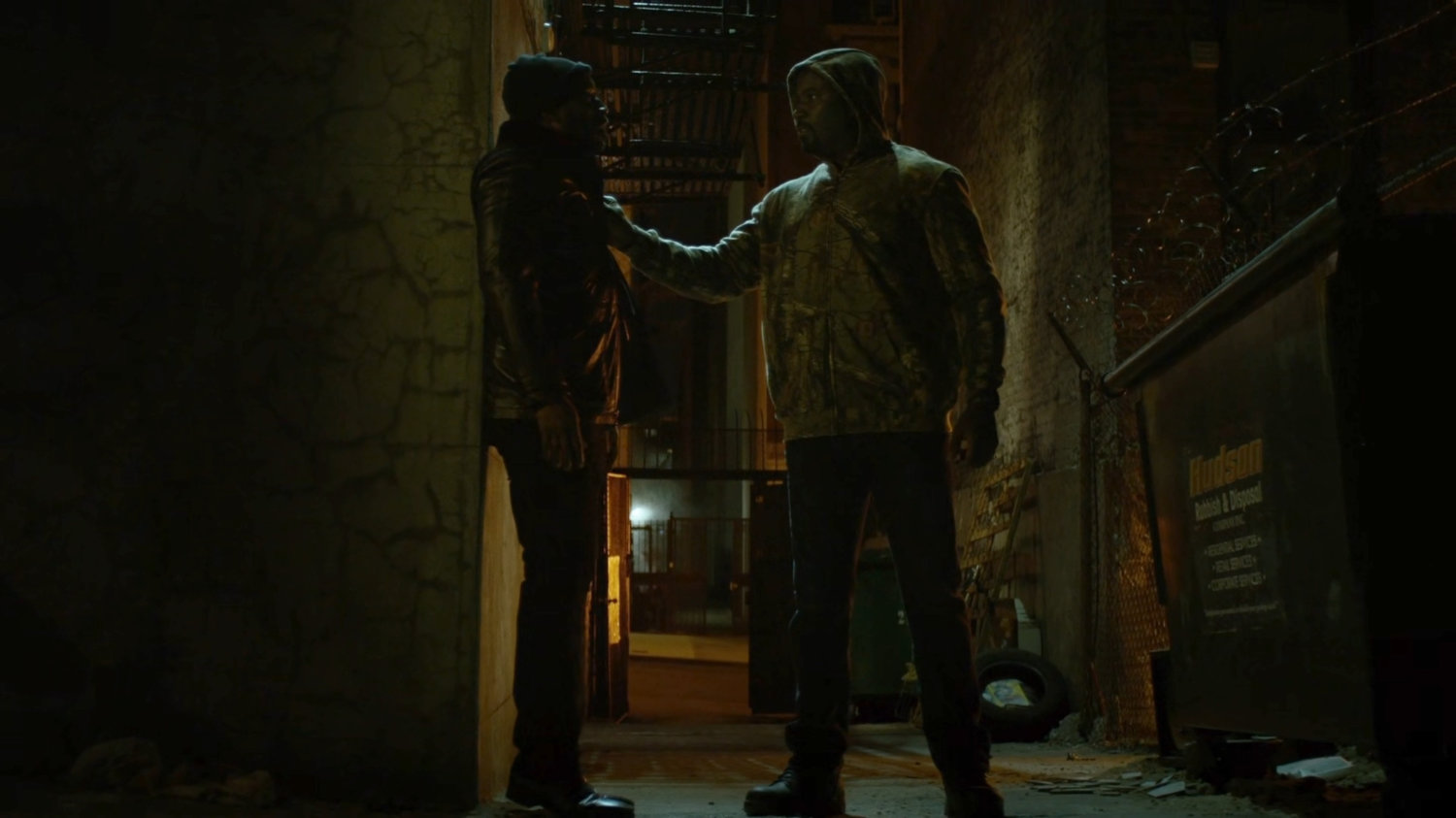 Luke threatens Turk in a dark alley.